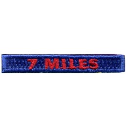 The words 7 Miles are stitched in red on a blue background.