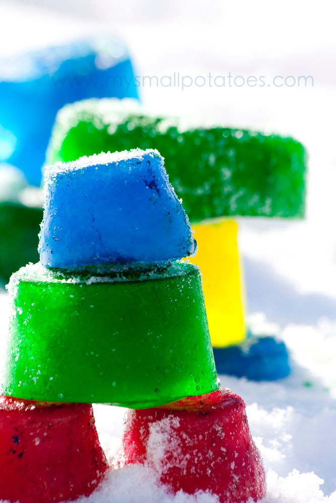 An inukshuks made out of colourful ice.