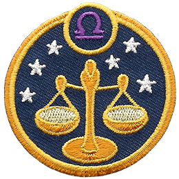 This circular crest displays the scales of justice surrounded by stars. The sign of Libra sits above it.