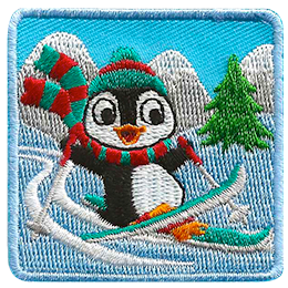 Penguin skiing down a hill wearing a red and green scarf.