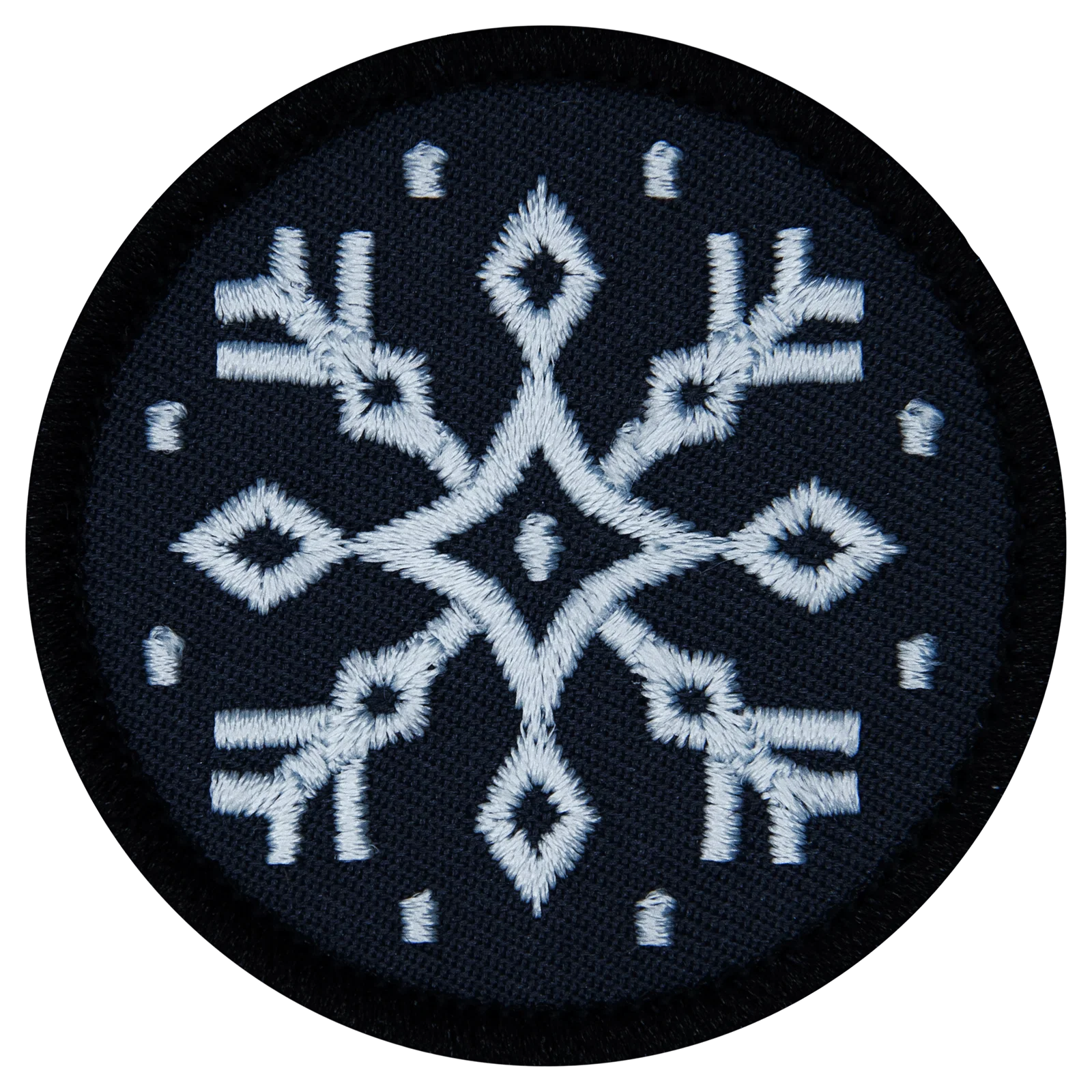 A snowflake on a black patch. 