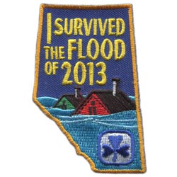 The words I Survived The Flood of 2013 on the province of Alberta.
