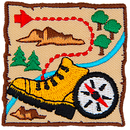 A yellow boot on a brown map with a red treasure marker. 