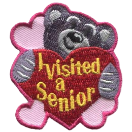 A bear hugs a red heart with the words I Visited A Senior.