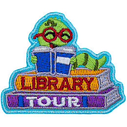A book worm reads a book on top of two books on this adorable patch.