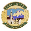 A pin of Ehrennadel Mittenwald with a colour fill outline.