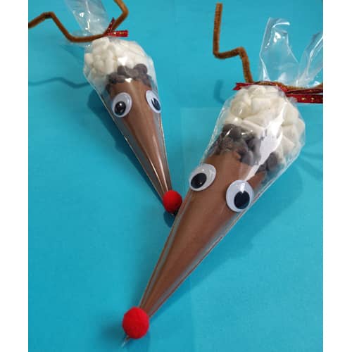Tubes of hot chocolate decorated to look like reindeer. 