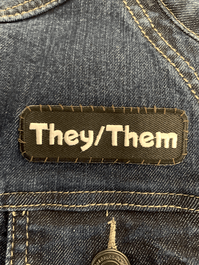 they/them patch on a jacket