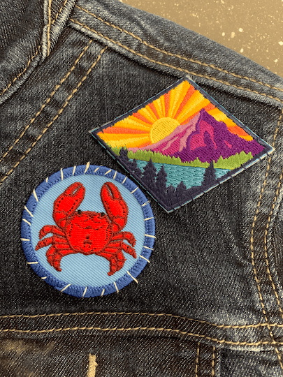 Crab circle badge and Call of the Wild patch