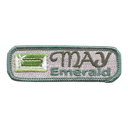The words May and Emerald are next to an emerald.