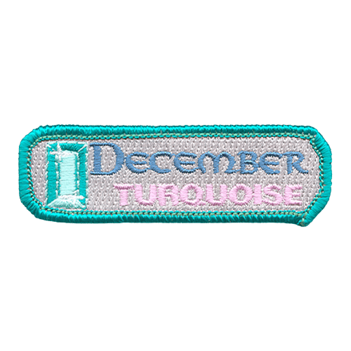 The words December Torquoise are next to a turquoise gemstone.