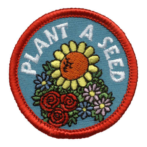 A group of flowers with the words Plant A Seed.