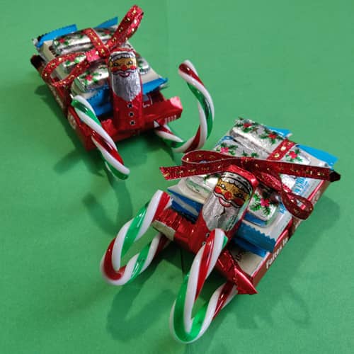 Candy sleighs made out of chocolate bars and candy canes.