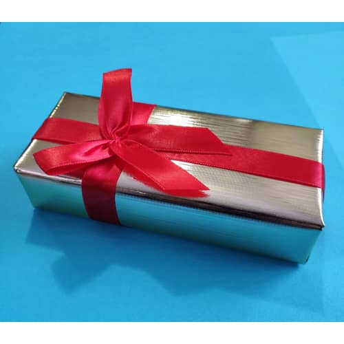 A wrapped silver box with a red ribbon.